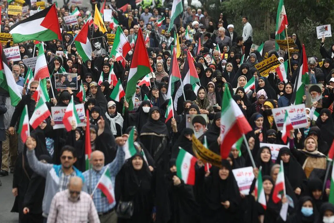Iranians attend a rally in support of Palestinians, in Tehran, Iran, October 13, 2023. Majid Asgaripour/WANA (West Asia News Agency) via REUTERS