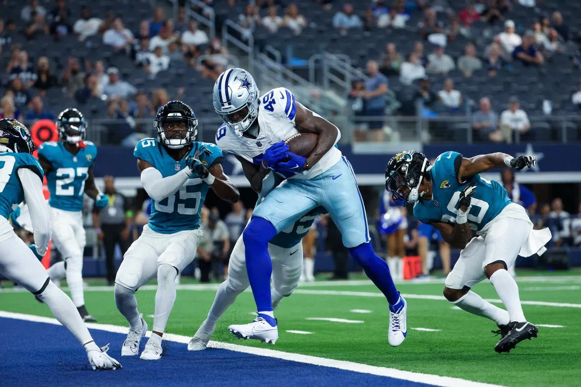 FILE PHOTO: Aug 12, 2023; Arlington, Texas, USA;  Dallas Cowboys wide receiver John Stephens Jr. (49) scores a touchdown  during the second half against the Jacksonville Jaguars at AT&T Stadium. Mandatory Credit: Kevin Jairaj-USA TODAY Sports/File Photo