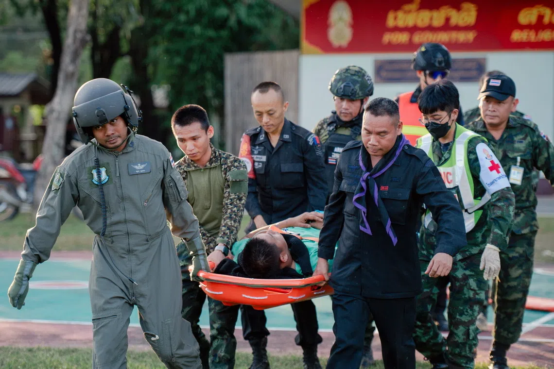 An injured Thai soldier is transferred to a hospital after a clash between Thai and Cambodian troops over the border dispute at Si Sa Ket province.