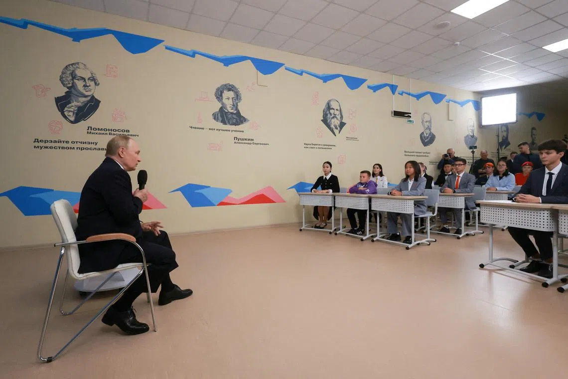 Russian President Vladimir Putin speaks with pupils during the lesson \"Talking of What Matters\" as he visits a local school to mark Knowledge Day in Kyzyl in the Republic of Tuva, Russia September 2, 2024. Sputnik/Vyacheslav Prokofyev/Pool via REUTERS
