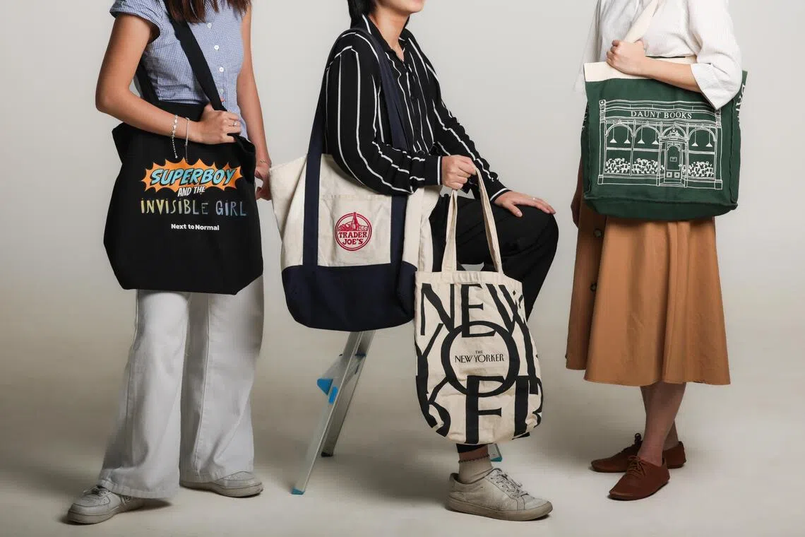 Photo of various popular tote bags, including those from Trader Joe?s, Daunt Books and The New Yorker, photographed at the ST photo studio on May 12, 2026.