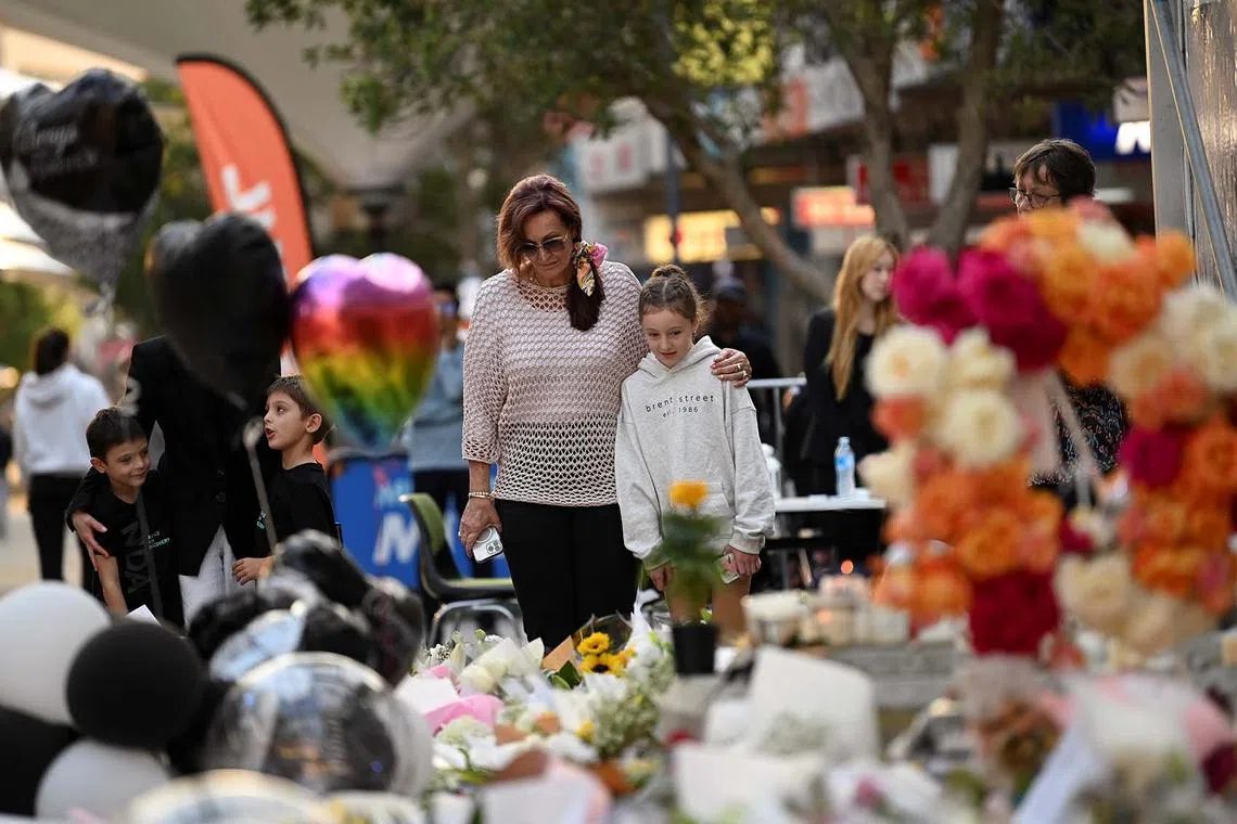People leaving floral tributes for victims after the attack at Westfield Bondi Junction shopping centre, in Sydney, Australia, April 17 2024. 
