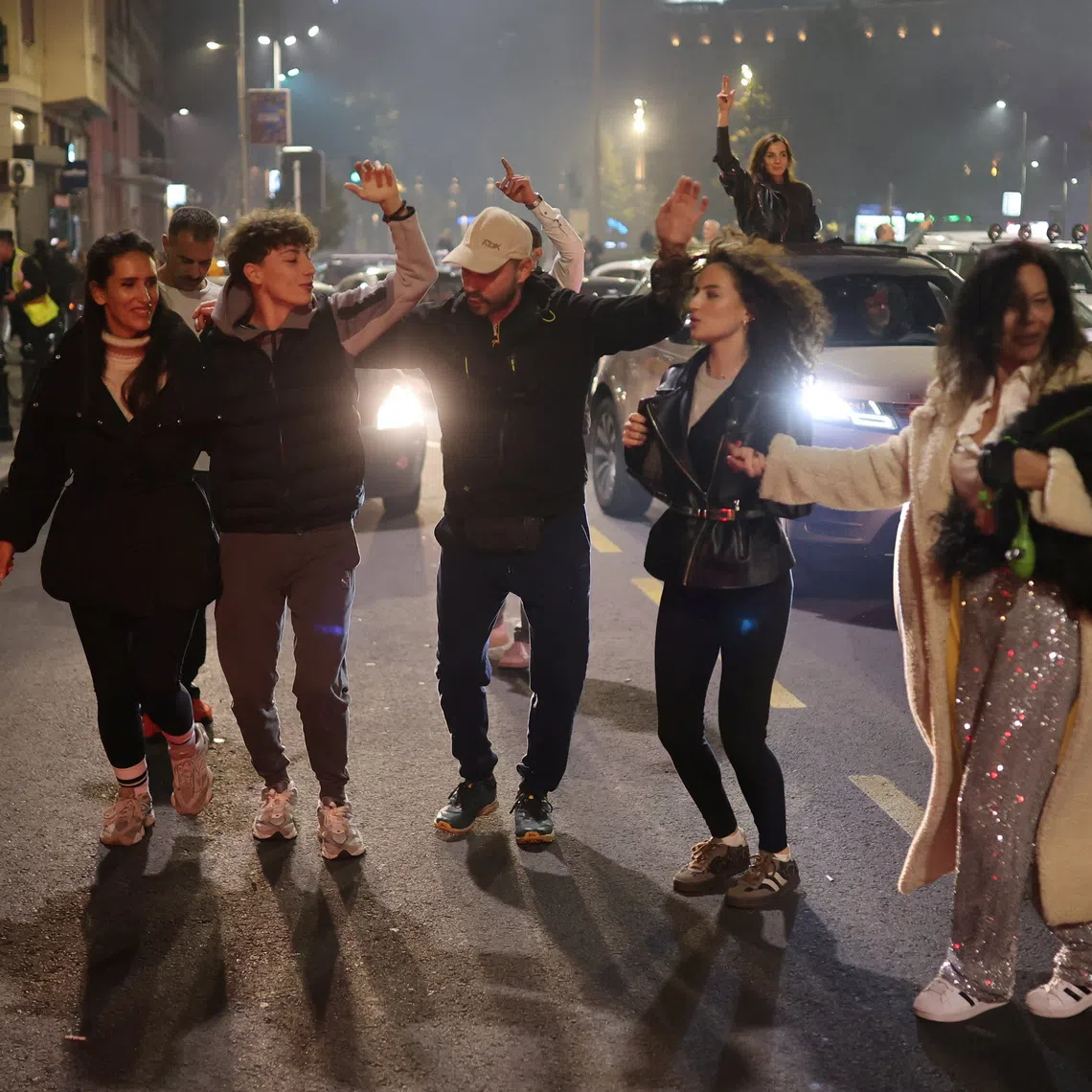 Supporters of the electoral list \"Student List - Students Win\" celebrate after long-time ruler Aleksandar Vucic conceded defeat in the parliamentary election, in Belgrade, Serbia, October 25, 2026. REUTERS/Djordje Kojadinovic