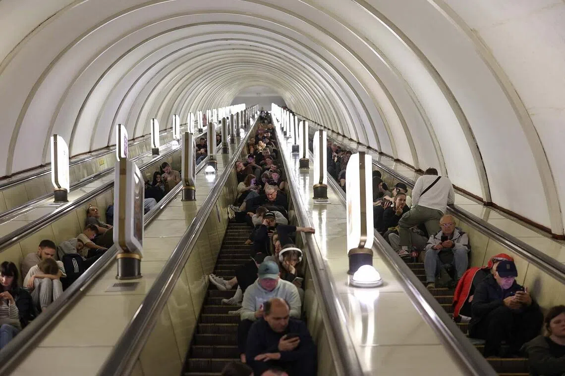 People sheltering in a metro station during a Russian missile strike on the Ukrainian capital Kyiv on June 15, amid the Russian invasion in Ukraine. 