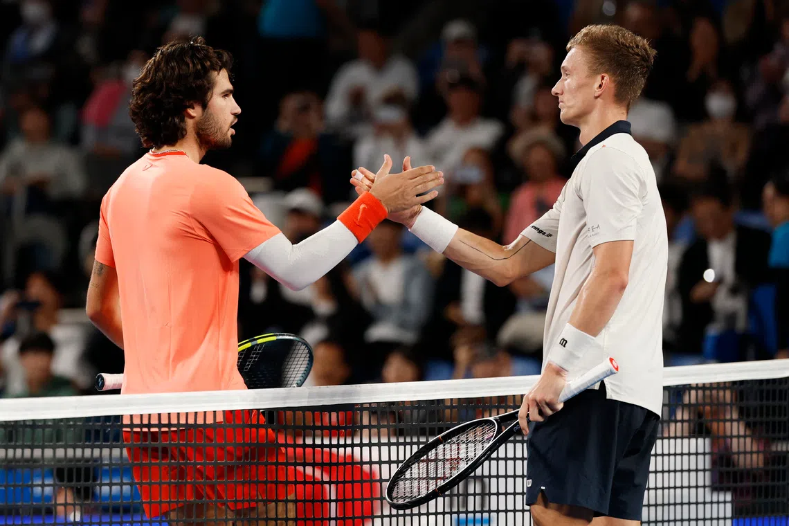 Spain’s Carlos Alcaraz (left) shakes hands with Czech Republic’s Jiri Lehecka after retaining his title.