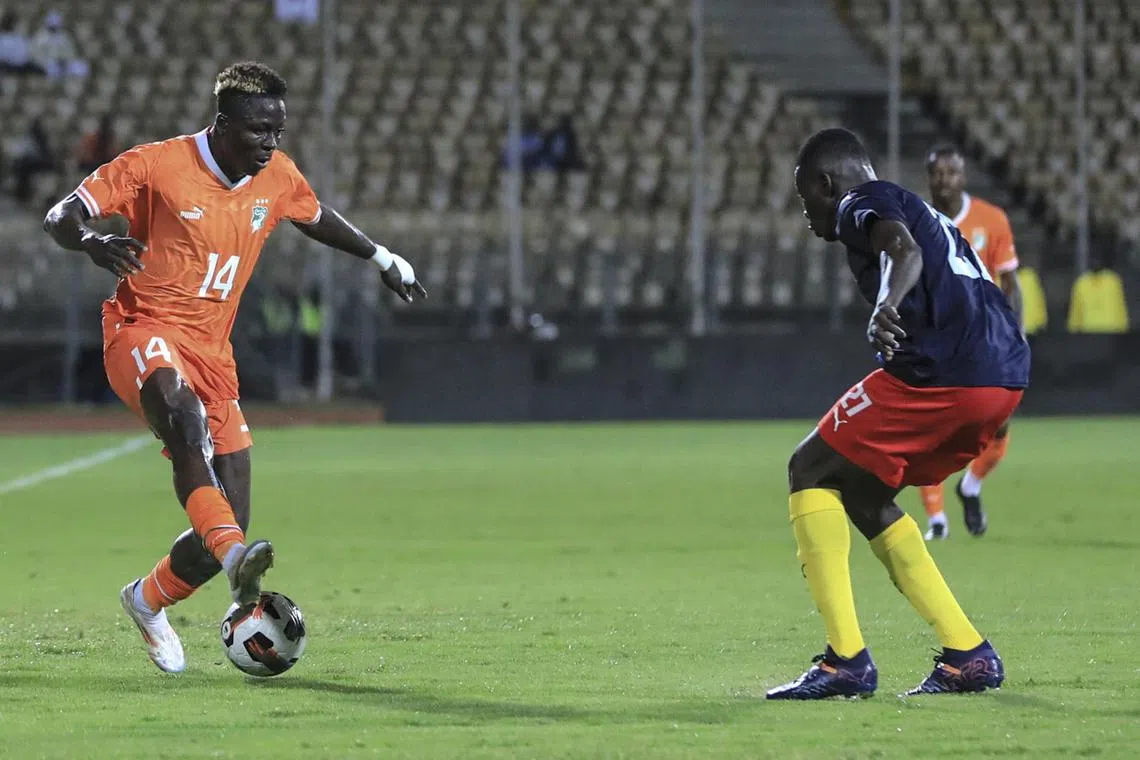 Ivory Coast forward Oumar Diakite trying to get past Chad midfielder Natoyoum Osee in  the Africa Cup of Nations group G qualifier at the Ahmadou Ahidjo stadium in Yaounde, Cameroon on Sept 10, 2024.