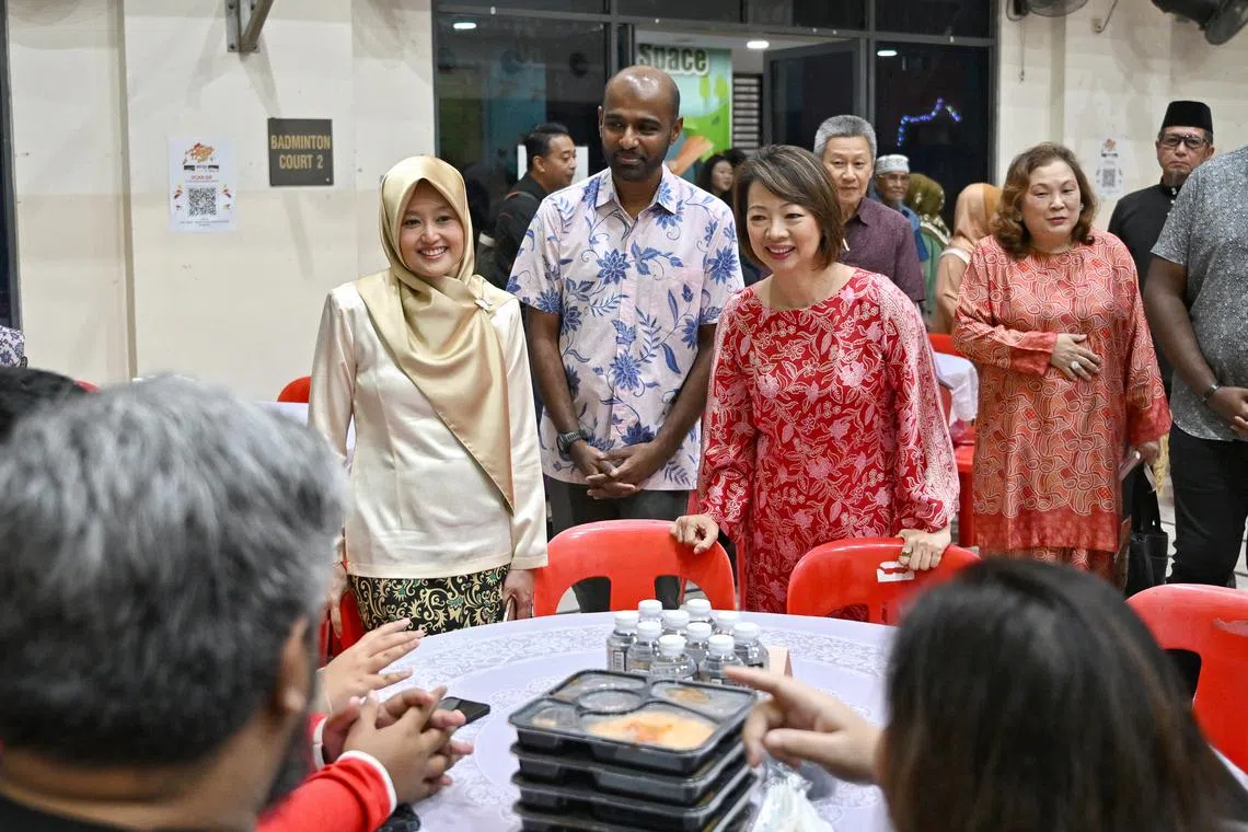 (From left) Minister of State for Health and Digital Development and Information Rahayu Mahzam, West Coast GRC MP Foo Mee Har, and Second Advisor to Jurong GRC Grassroots Organisations Dr Hamid Razak chatting with beneficiaries at Gek Poh Ville Community Club on March 23.
