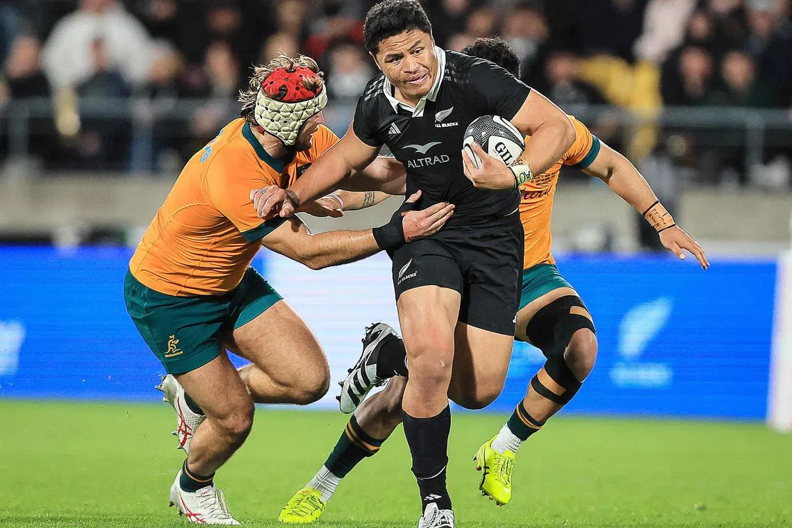 New Zealand's Caleb Clarke (centre) making a break during The Rugby Championship and Bledisloe Cup match between the All Blacks and Australia at Sky Stadium in Wellington on Sept 28.