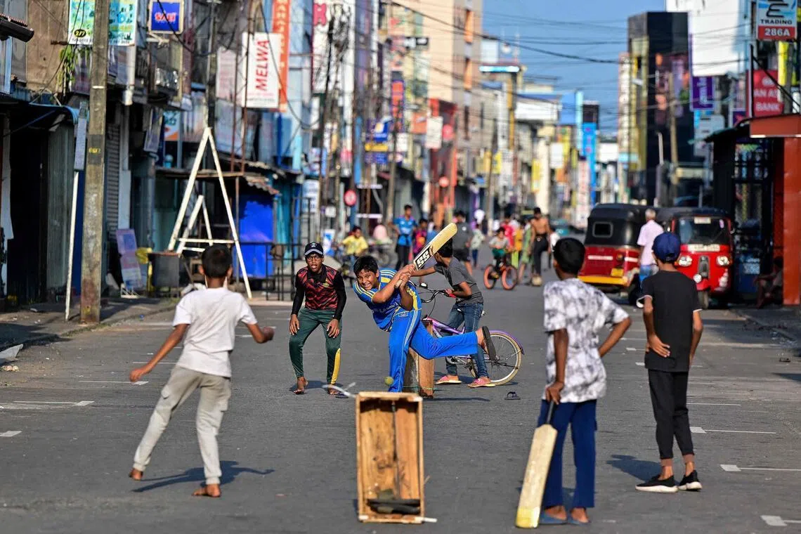Children playing cricket in Sri Lanka, which is co-hosting the ICC Men’s T20 World Cup with India