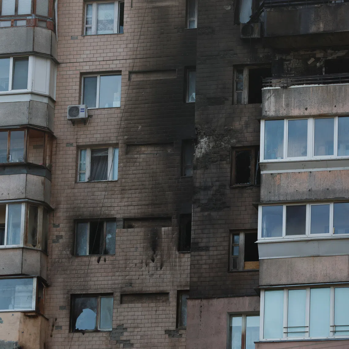 Smoke marks on the facade of a residential building damaged during a Russian drone and missile strike, amid Russia's attack on Ukraine, in Kyiv, October 22, 2025. REUTERS/Alina Smutko