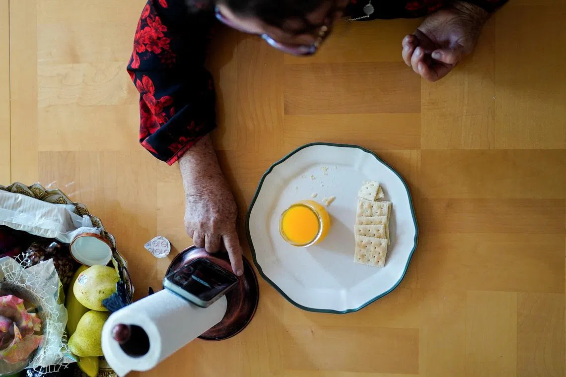 Doris Aguirre, an immigrant from Honduras, participates virtually in a Sunday service of the immigrant-focused Lincoln United Methodist Church, due to the threat of immigration sweeps, in Chicago, Illinois, U.S. August 31, 2025.  REUTERS/Audrey Richardson