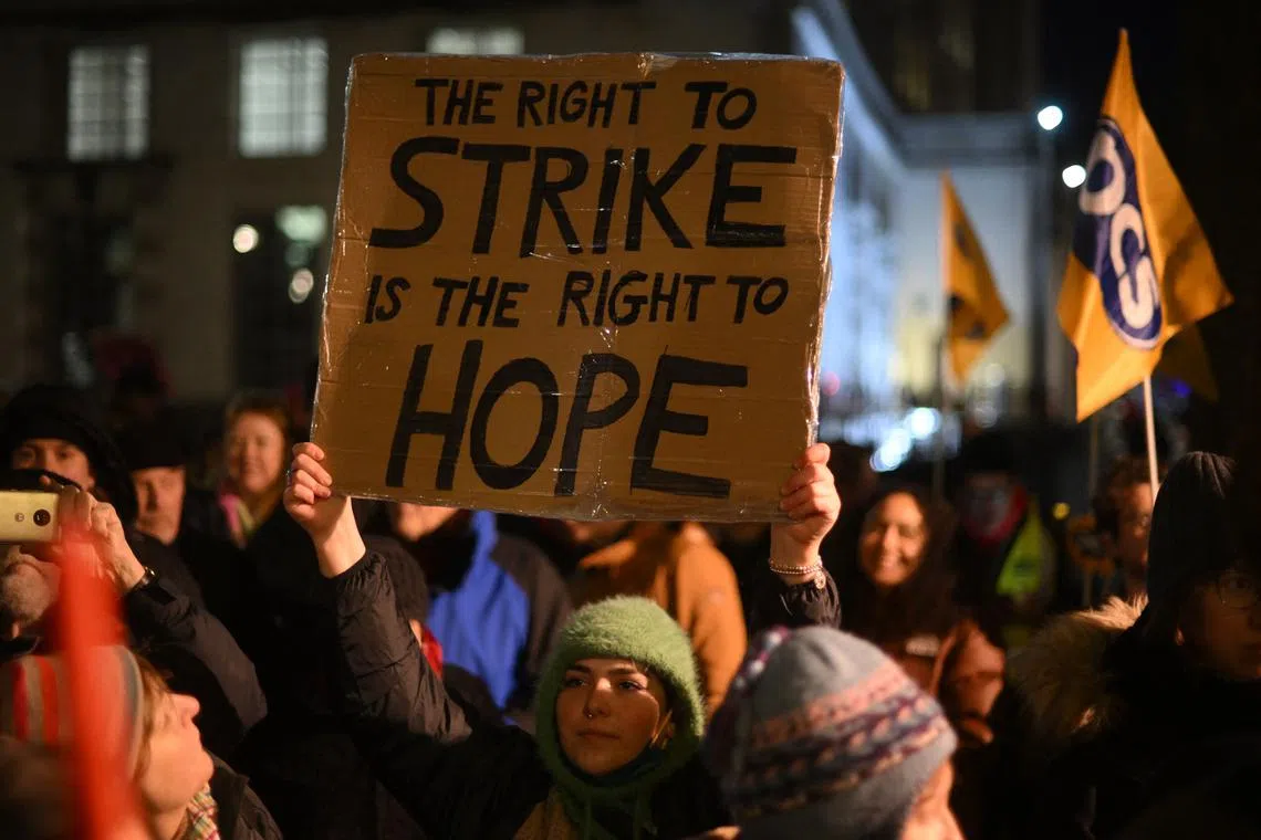 Demonstrators protest opposite 10 Downing Street in central London during strikes on Jan 16, 2023. 