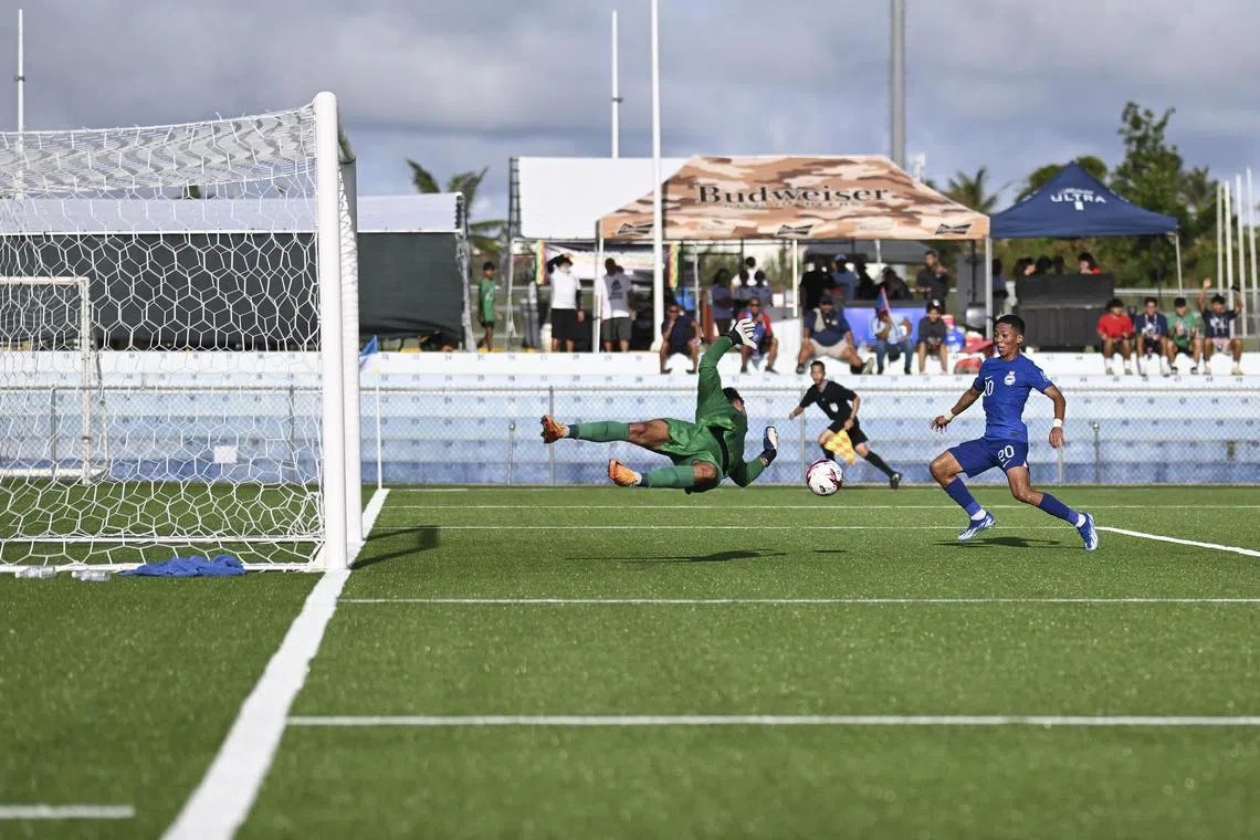 dlsoc17 - Singapore forward Shawal Anuar (right) made amends for his misses in the first leg to score the winner in the second leg against Guam.

credit: Football Association of Singapore
section: Sports
copyright: For SPH use only