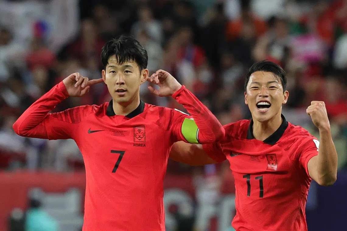 Son Heung-min (left) celebrates scoring the winning goal for South Korea.