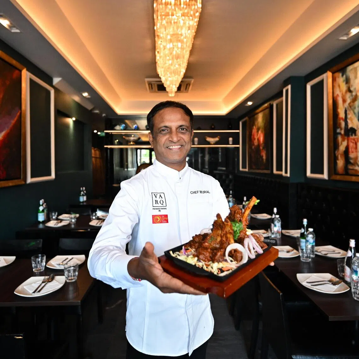 ST20251028-202529400622-Lim Yaohui-Eunice Quek-eqindian02/

Chef Manjunath Mural, 51, Group Director of Cuisine, The Song of India Group, holing Kashmiri Wazwan Lamb Rack Sizzler costs $18, at Indian Saaga restaurant on the first floor of 38 Race Course Road on Oct 28, 2025. 

Feature on new/revamped Indian restaurants.

(ST PHOTO: LIM YAOHUI)