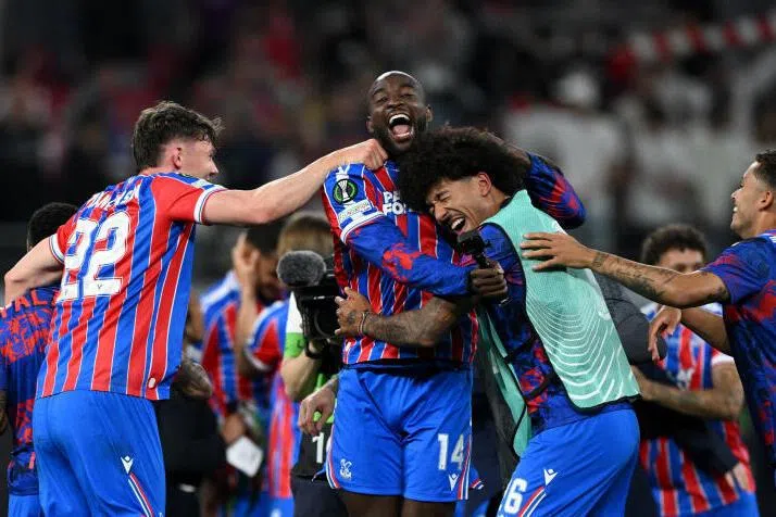 Crystal Palace's Jean-Philippe Mateta celebrates with teammates after winning the UEFA Conference League.