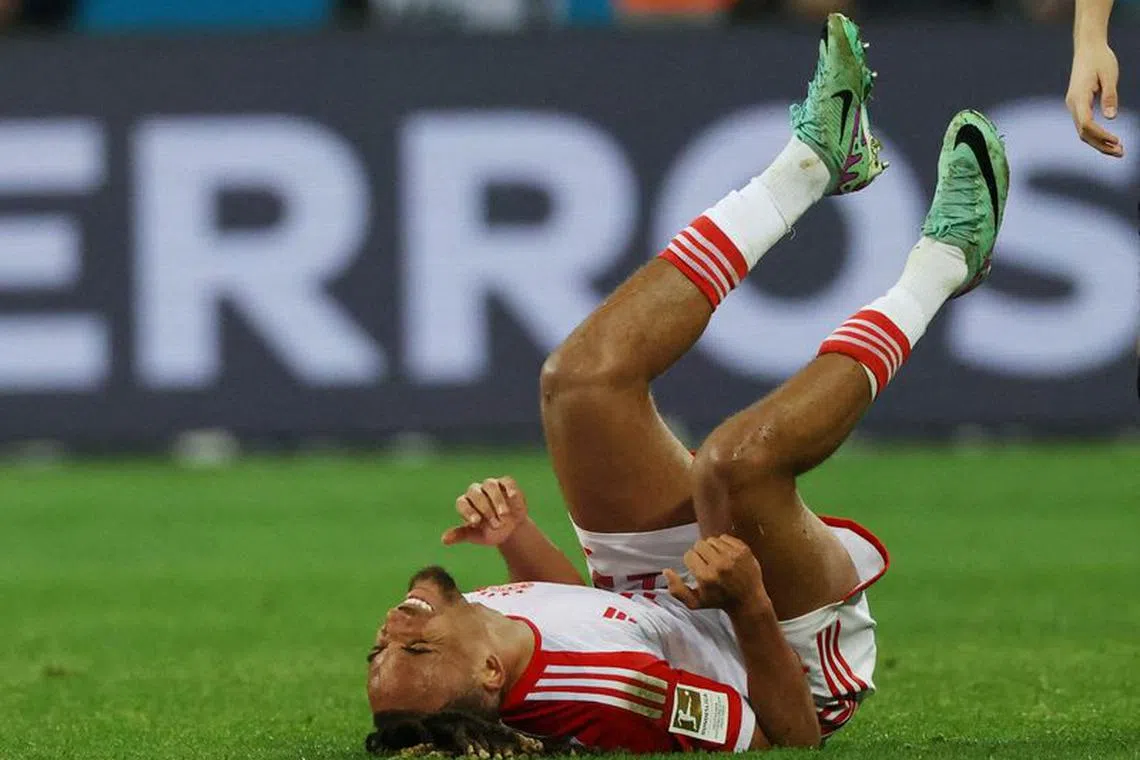 FILE PHOTO: Soccer Football - Bundesliga - Bayer Leverkusen v Bayern Munich - BayArena, Leverkusen, Germany - February 10, 2024 Bayern Munich's Sacha Boey reacts after sustaining an injury REUTERS/Thilo Schmuelgen