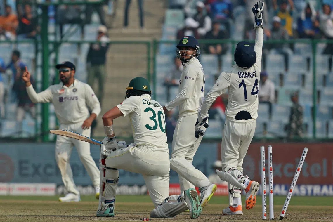 FILE PHOTO: Cricket - Second Test - India v Australia - Arun Jaitley Stadium, New Delhi, India - February 19, 2023 Australia's Pat Cummins is bowled out by India's Ravindra Jadeja REUTERS/Anushree Fadnavis/File Photo