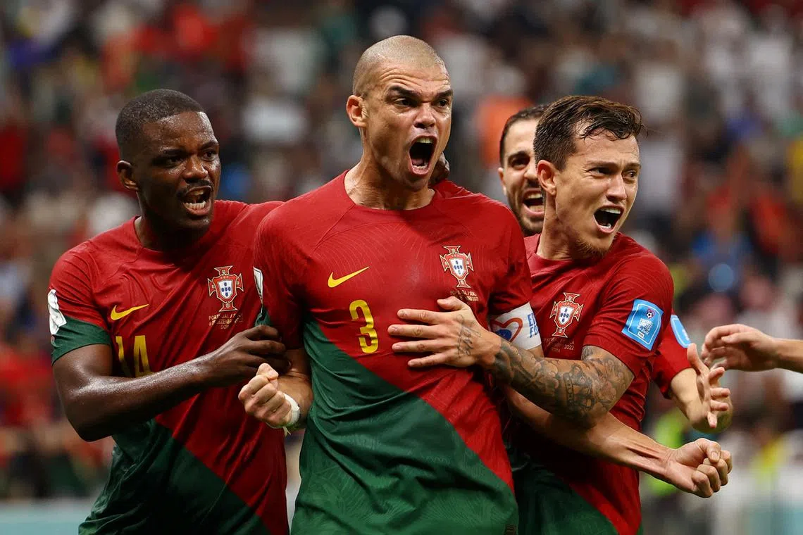 Portugal's Pepe celebrates scoring their second goal with teammates during the Qatar 2022 World Cup round of 16 football match between Portugal and Switzerland at Lusail Stadium in Lusail, Qatar, Dec 6, 2022.