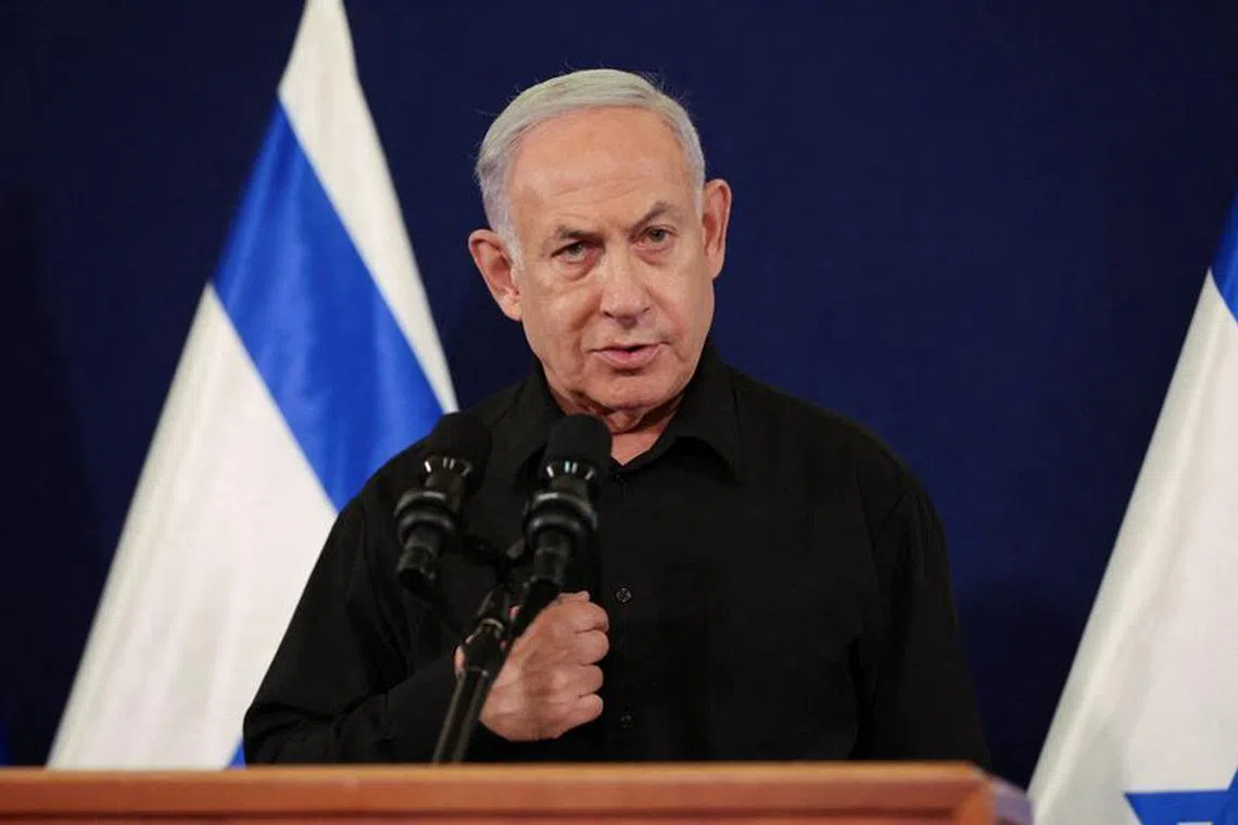 Israeli Prime Minister Benjamin Netanyahu holds a press conference with Defense Minister Yoav Gallant and Cabinet Minister Benny Gantz (not pictured) in the Kirya military base in Tel Aviv , Israel , 28 October  2023.    ABIR SULTAN POOL/Pool via REUTERS