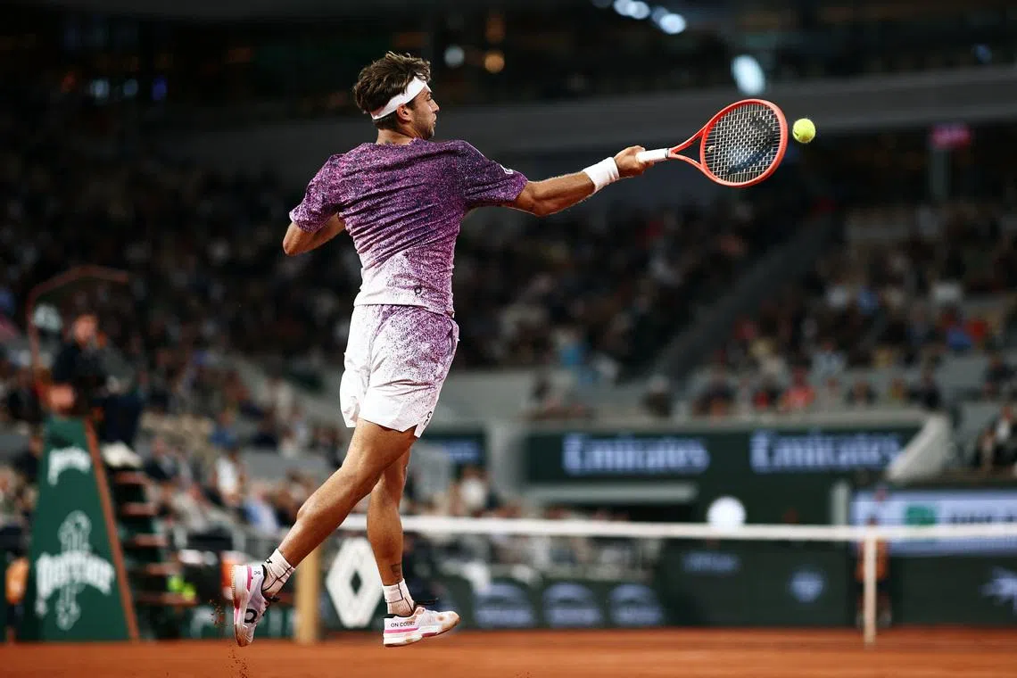 Italy's Flavio Cobolli in action during his 4-6, 6-4, 6-4, 6-4 French Open quarter-final win over Canada's Felix Auger-Aliassime at Roland Garros on June 3.