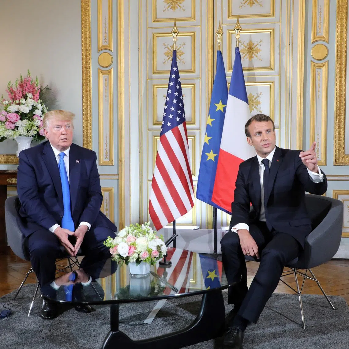 U.S. President Donald Trump and French President Emmanuel Macron speak during a meeting at the Prefecture of Caen, Normandy, France June 6, 2019, on the sidelines of D-Day commemorations marking the 75th anniversary of the World War II Allied landings in Normandy. Ludovic Marin/Pool via REUTERS