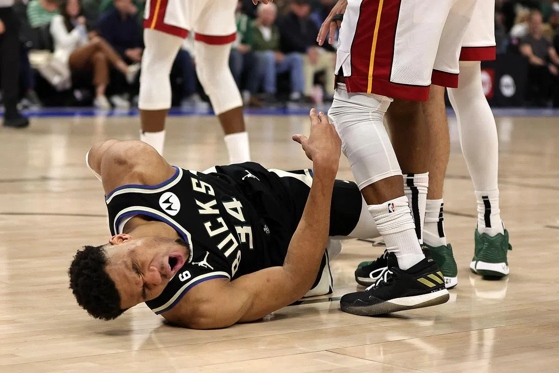 Giannis Antetokounmpo of the Milwaukee Bucks is injured during Game 1 of the Eastern Conference First Round play-offs against the Miami Heat at Fiserv Forum on Sunday in Milwaukee, Wisconsin. 