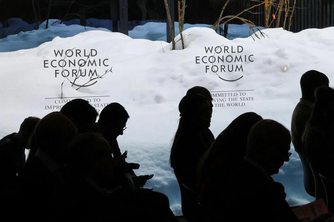 FILE PHOTO: People attend the 54th annual meeting of the World Economic Forum in Davos, Switzerland, January 17, 2024. REUTERS/Denis Balibouse/