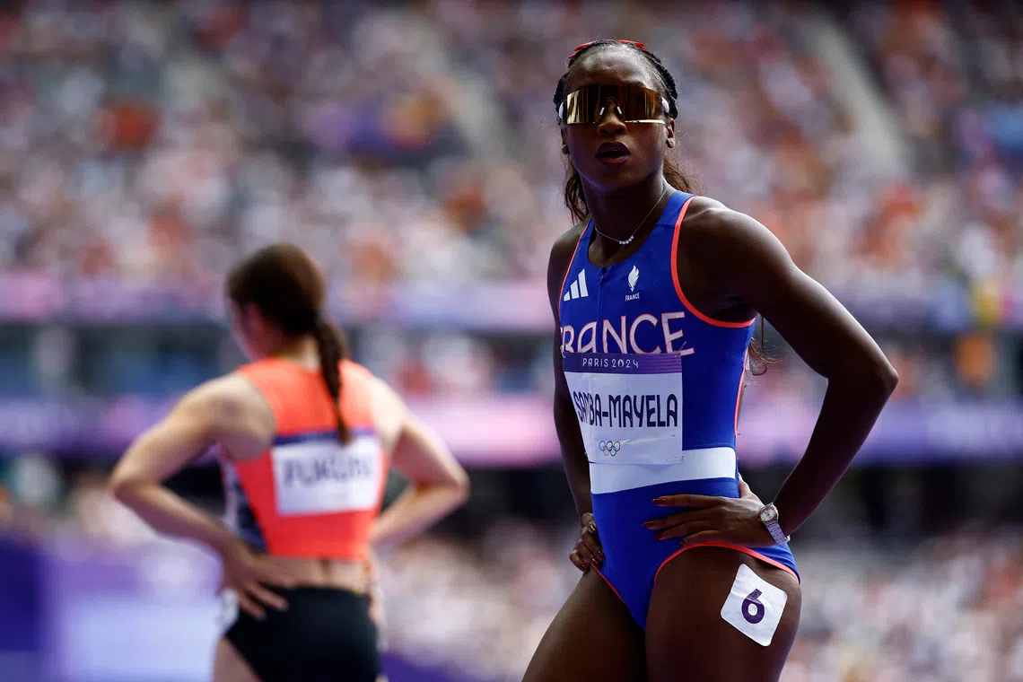 FILE PHOTO: Paris 2024 Olympics - Athletics - Women's 100m Hurdles Semi-Final - Stade de France, Saint-Denis, France - August 09, 2024. Cyrena Samba-Mayela of France reacts after competing in semi final 3. REUTERS/Sarah Meyssonnier/File Photo