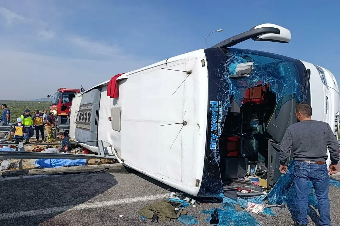 Fire department and first aid officials operating at the site, where a coach collided with a truck on Oct 11, in Manisa, west of Turkey.
