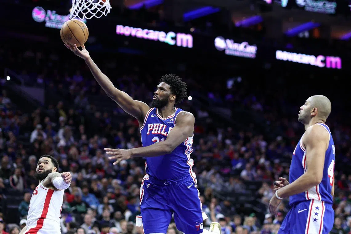  Joel Embiid of the Philadelphia 76ers shooting a lay up past Fred VanVleet of the Houston Rockets during the third quarter at the Wells Fargo Centre.