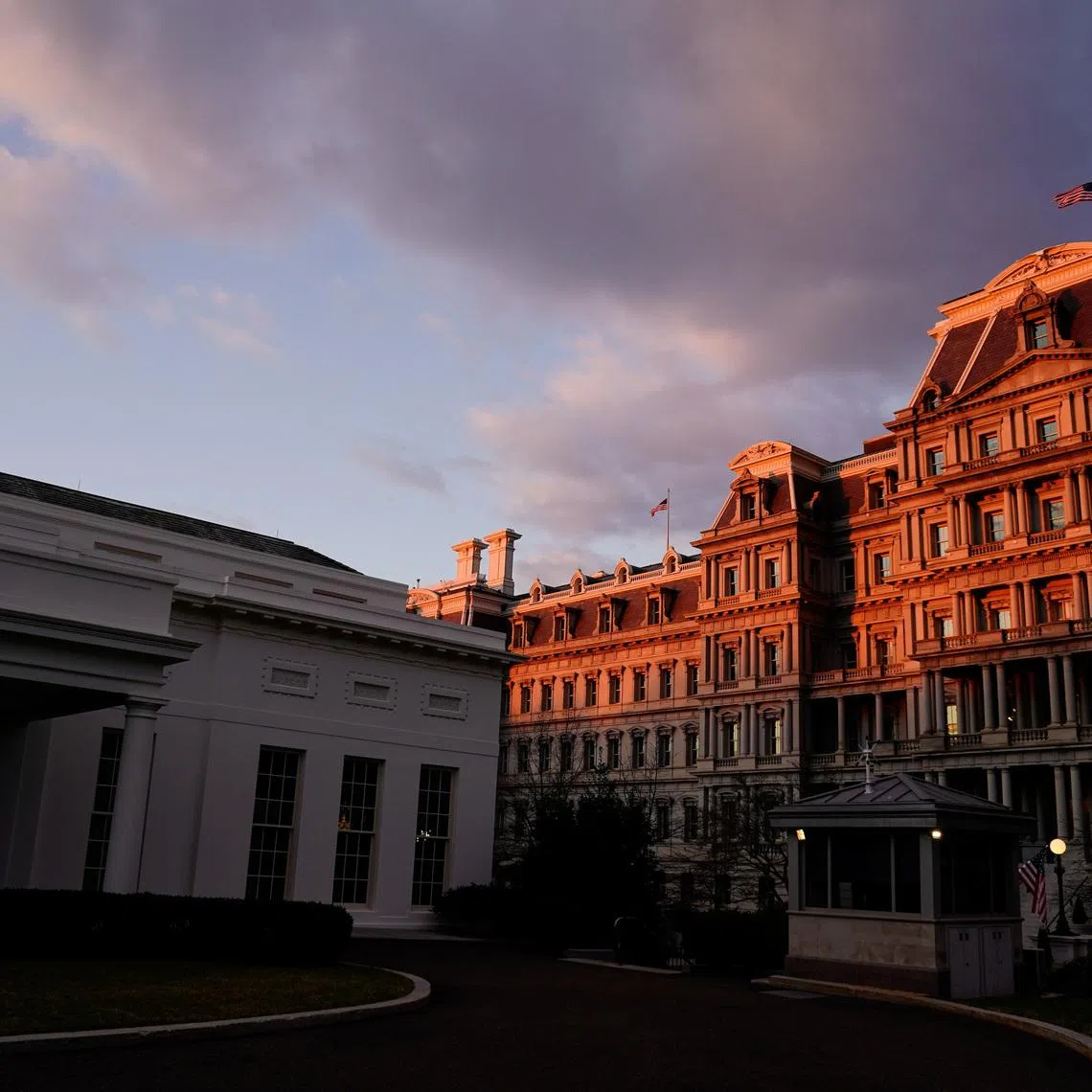 The West Wing of the White House and the Eisenhower Executive Office Building are seen at sunrise in Washington, U.S., January 23, 2021. REUTERS/Erin Scott