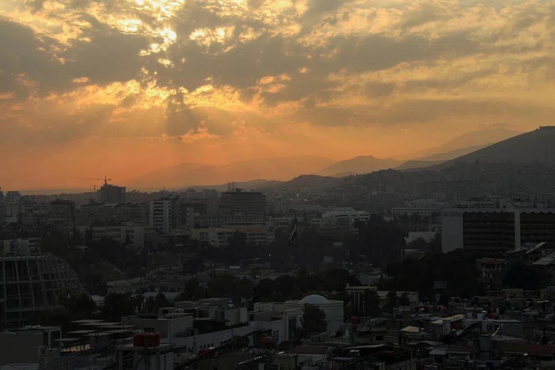 The sun sets over the skyline of Damascus, Syria, November 18, 2025. REUTERS/Orhan Qereman