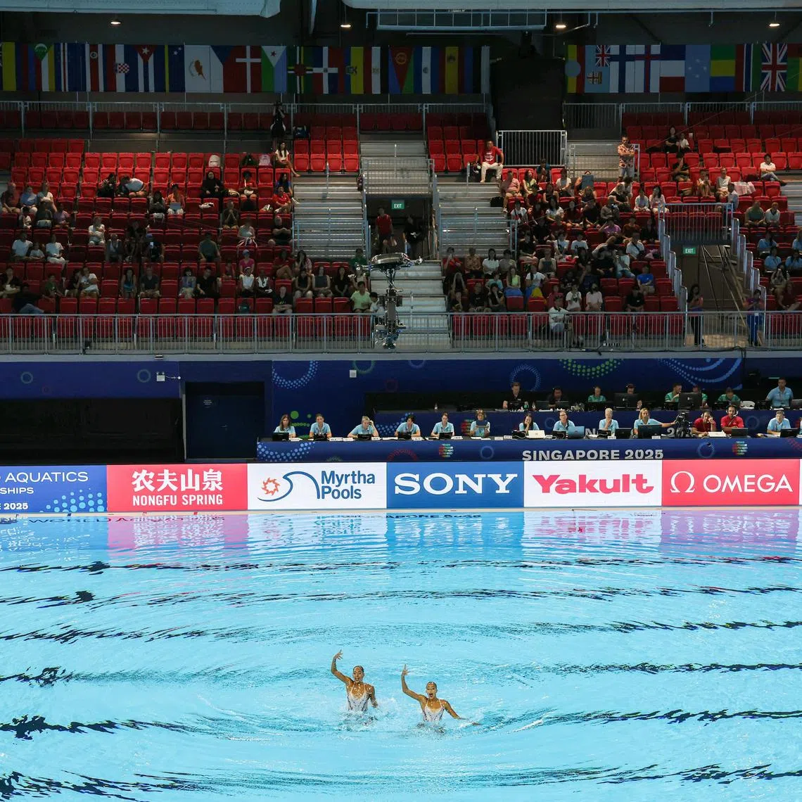 Eygptian artistic swimmers Zeina Amr and Maryam Samer competing in the women's duet technical preliminary round at the World Aquatics Championships Arena on July 18, 2025.