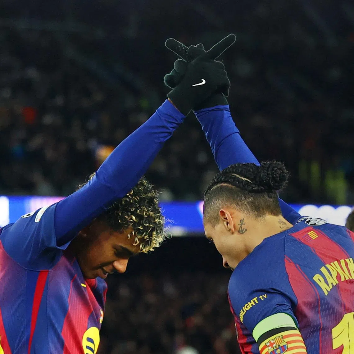 Soccer Football - UEFA Champions League - FC Barcelona v FC Copenhagen - Spotify Camp Nou, Barcelona, Spain - January 28, 2026 FC Barcelona's Raphinha celebrates scoring their third goal with  Lamine Yamal REUTERS/Albert Gea
