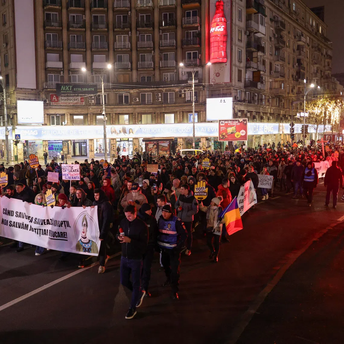 People take part in a march in support of judges and prosecutors who denounced dysfunction and call for integrity and transparency in the Romanian justice system, in Bucharest, Romania, December 14, 2025. Inquam Photos/Octav Ganea via REUTERS