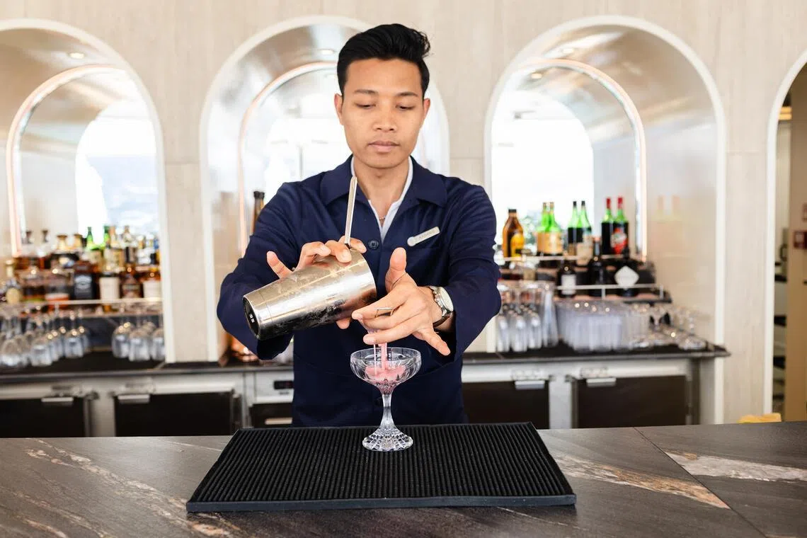 A barender at the ship’s Bar O mixes a drink aboard the Four Seasons I off the coast of Crete, Greece.