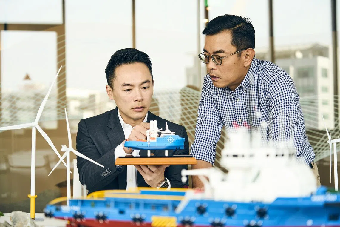Marco Polo Marine CEO Sean Lee examines a model of the company’s US$60 million commissioning service operation vessel. 