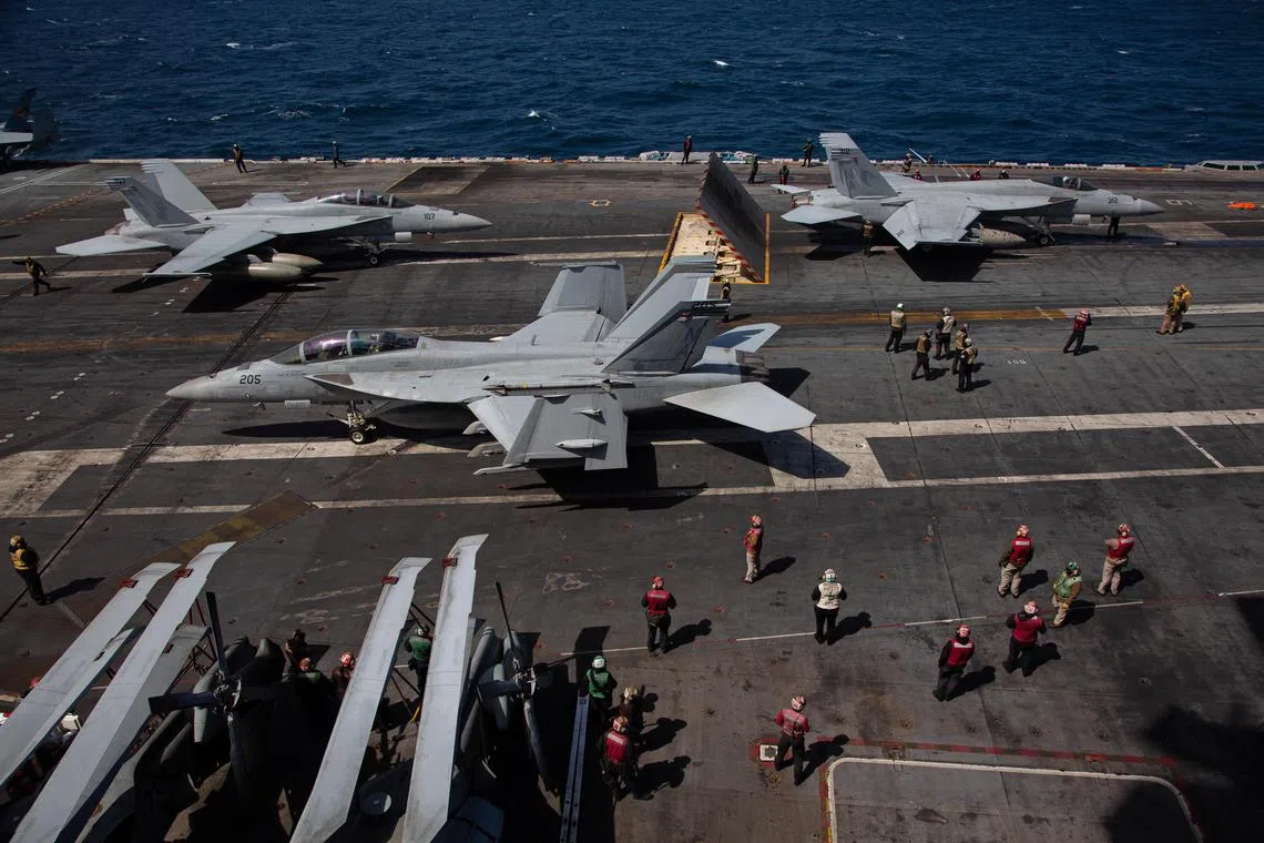 Jets prepare for take-off on the USS Nimitz aircraft carrier off the coast of Busan, South Korea, on March 27, 2023. 