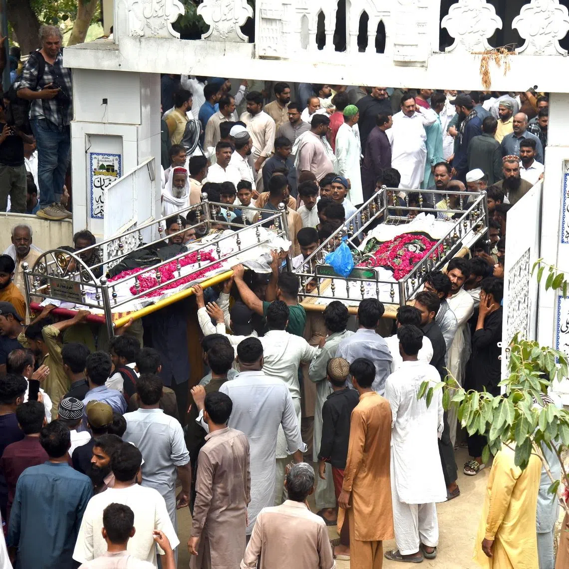 Mourners took part in funeral prayers at a local mosque on July 1 before the dead children were carried to the graveyard for burial.