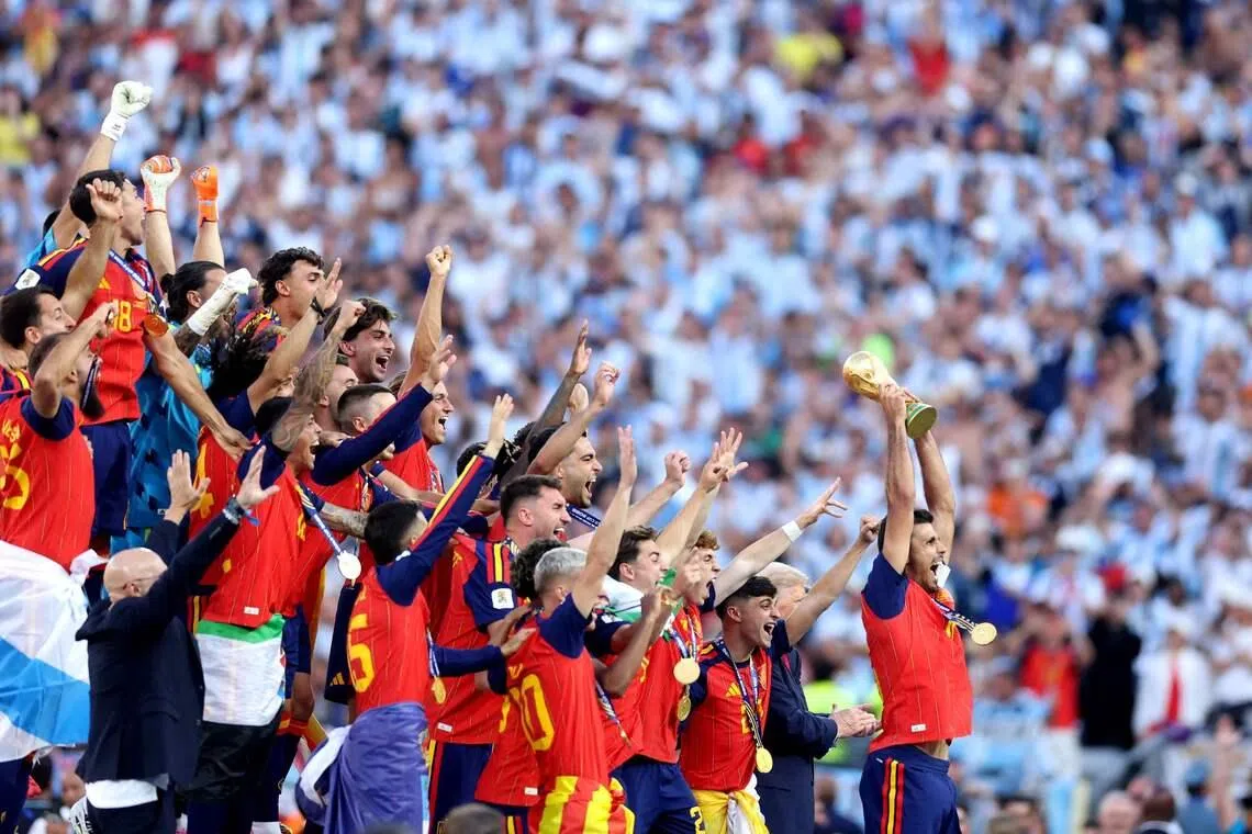 EAST RUTHERFORD, NEW JERSEY - JULY 19: Rodri #16 of Spain lifts the FIFA World Cup Winners Trophy after the teams victory following the FIFA World Cup 2026 Final match between Spain and Argentina at New York New Jersey Stadium on July 19, 2026 in East Rutherford, New Jersey.   Lars Baron/Getty Images/AFP (Photo by Lars Baron / GETTY IMAGES NORTH AMERICA / Getty Images via AFP)