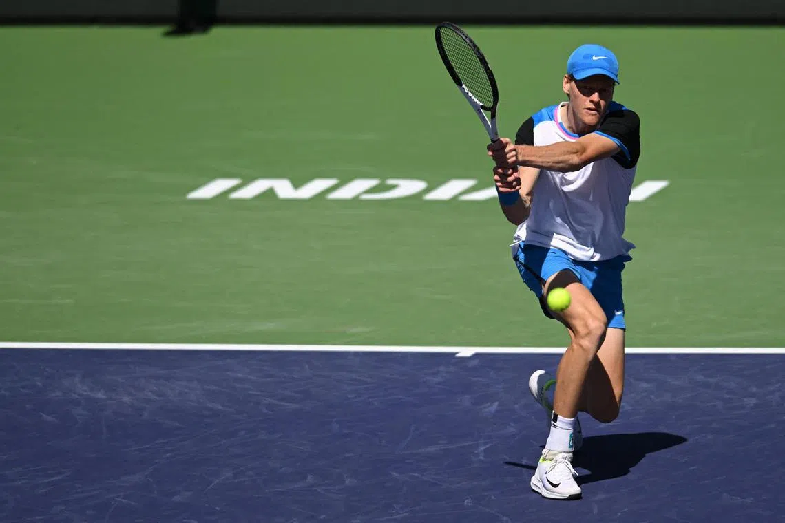 Jannik Sinner hits a backhand in his second-round match against Thanasi Kokkinakis during the BNP Paribas Open at Indian Wells.