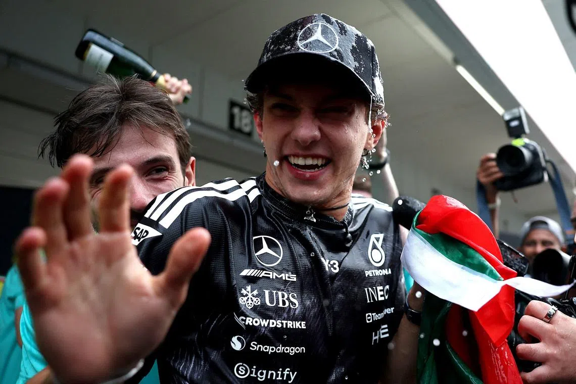 Formula One F1 - Japanese Grand Prix - Suzuka Circuit, Suzuka, Japan - March 29, 2026 Mercedes' Andrea Kimi Antonelli celebrates with his team after winning the Japanese Grand Prix REUTERS/Jakub Porzycki
