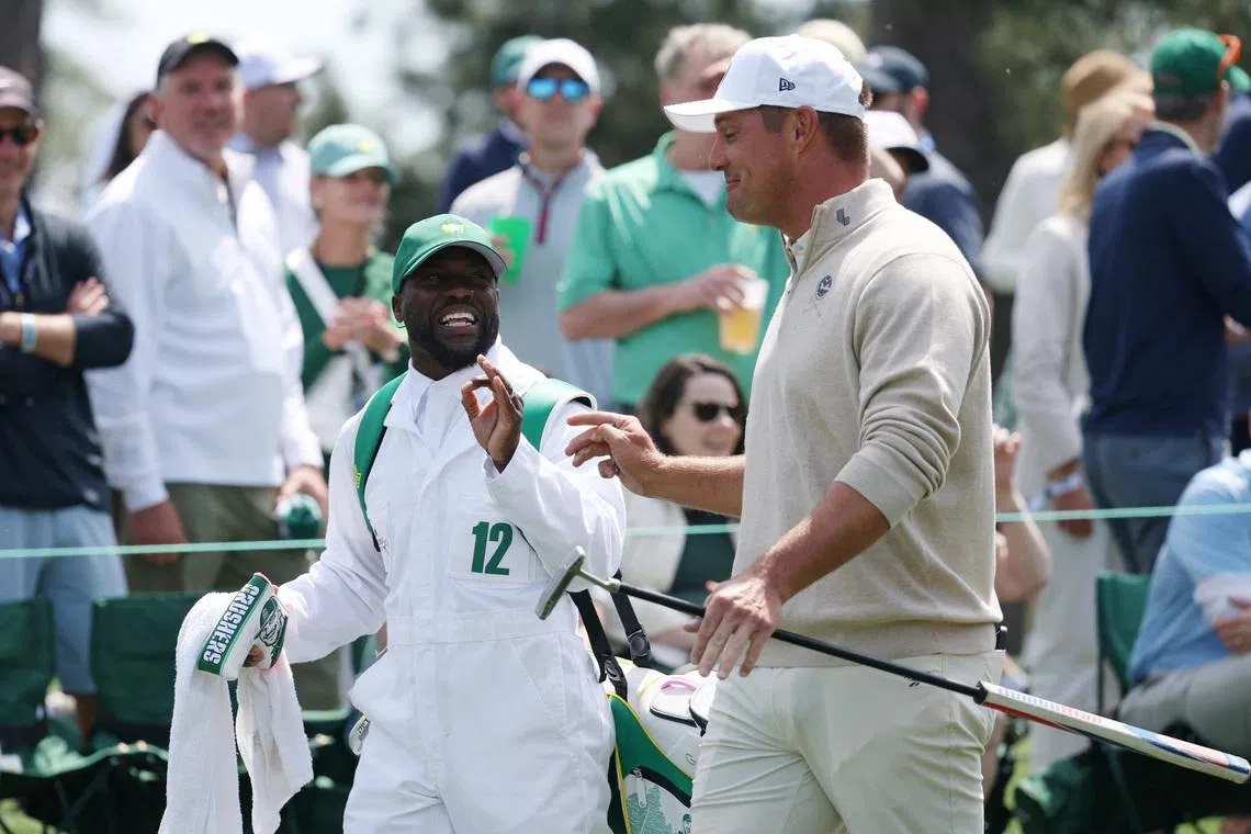 Golf - The Masters - Augusta National Golf Club, Augusta, Georgia, U.S. - April 8, 2026 Bryson DeChambeau of the U.S. with his caddie, actor and comedian Kevin Hart, on the 1st hole during the par 3 contest REUTERS/Mike Segar