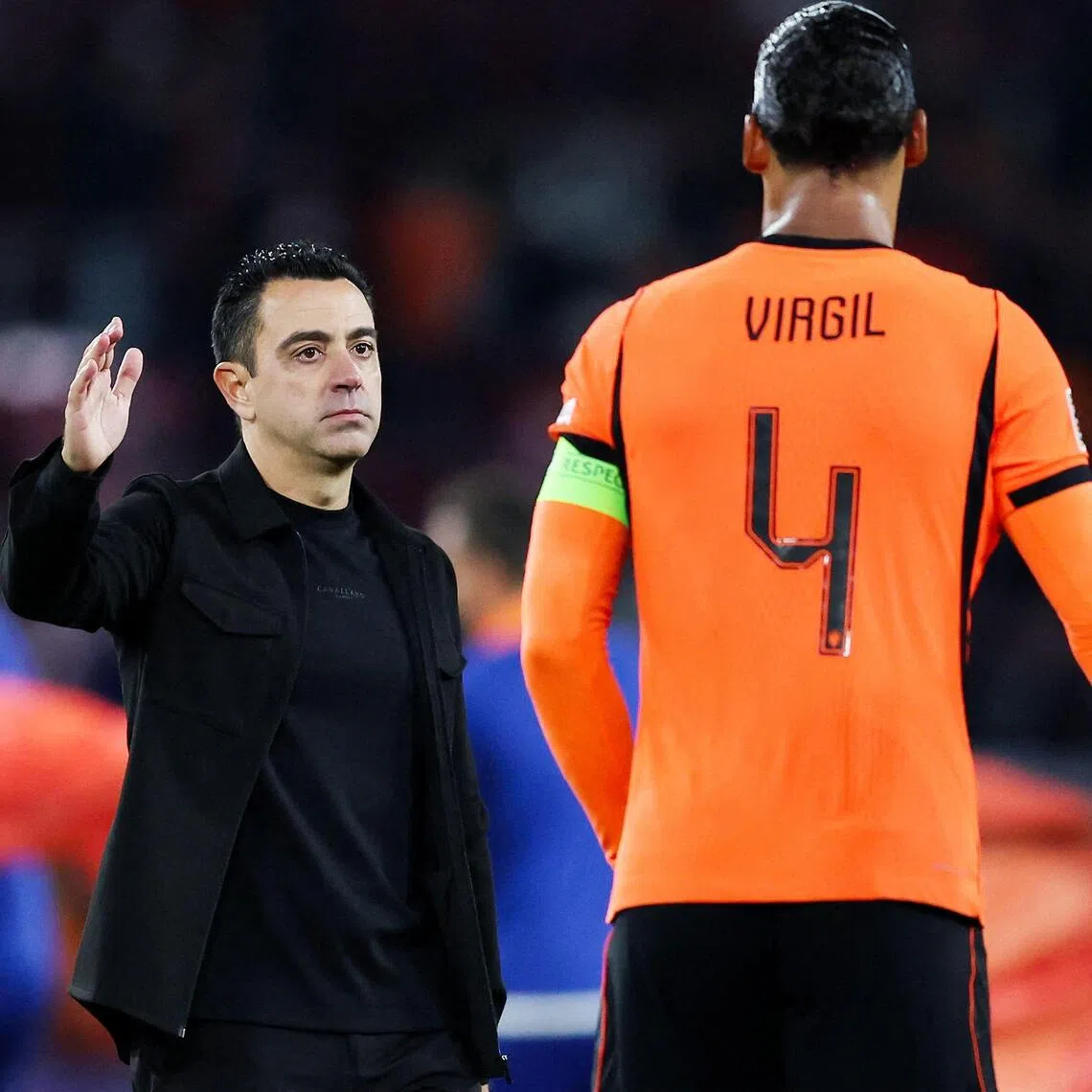 Netherlands’ coach Xavi Hernandez and Dutch defender Virgil van Dijk after the 2-1 Nations League victory over Serbia at the Philips Stadion in Eindhoven on Oct 4.