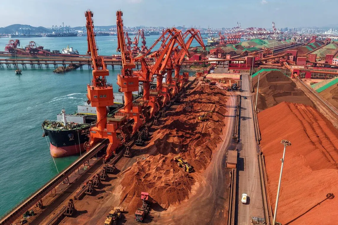 A cargo ship unloading imported iron ore at a port in Qingdao, China on July 30. Radiant World’s website says it is one of the world’s biggest iron ore traders.