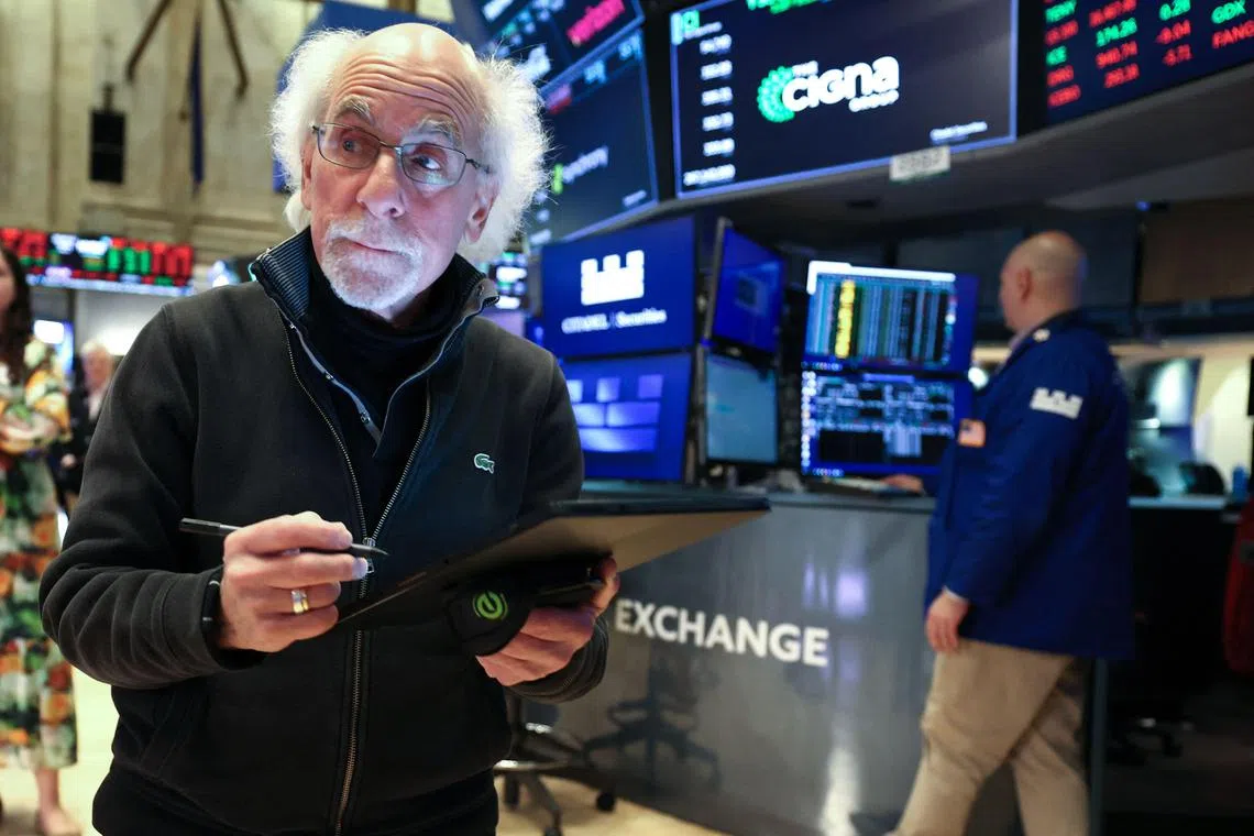 Traders working on the floor of the New York Stock Exchange at the opening bell in New York City, on May 6.