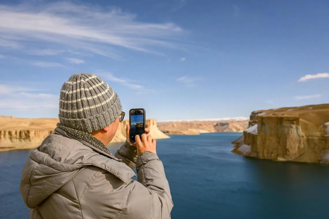 Dr Yi-Pin Lin, a tourist from the US, visits a mountain lake at Band-e-Amir, a national park in the province of Bamiyan in Afghanistan, on Nov 25.