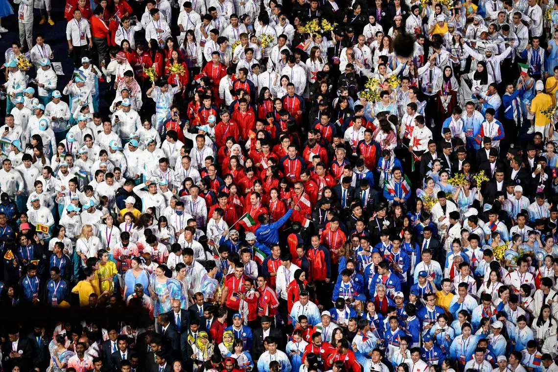 Members of national contingents parade during the closing ceremony of the 2022 Asian Games at the Hangzhou Olympic Sports Centre Stadium in Hangzhou on Oct 8, 2023.