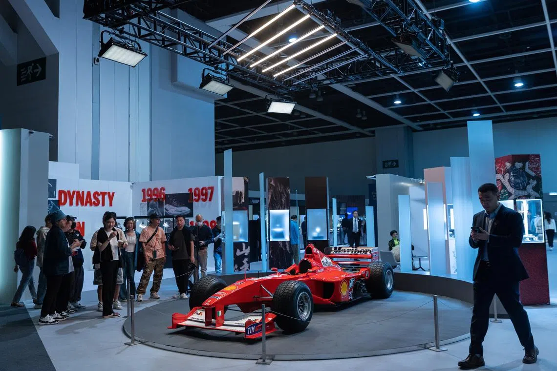 Visitors taking a close look at Michael Schumacher’s 2000 Ferrari F1-2000 during Sotheby’s Spring Sales auction preview in Hong Kong on April 3. 